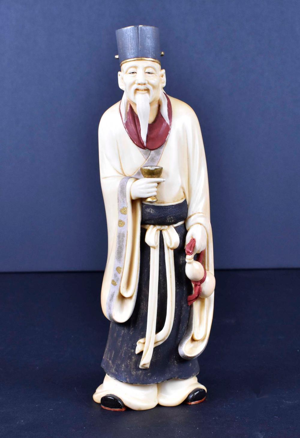 Appraisal: JAPANESE TEA AND RED STAINED OKIMONO OF A MYSTICMeiji Period