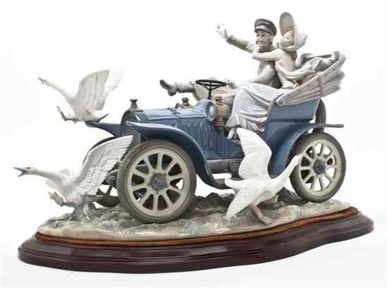 Appraisal: A Lladro Porcelain Figural Group Car in Trouble issued in