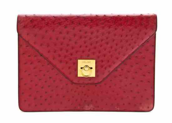 Appraisal: A Celine Red Ostrich Clutch goldtone hardware Stamped Celine x