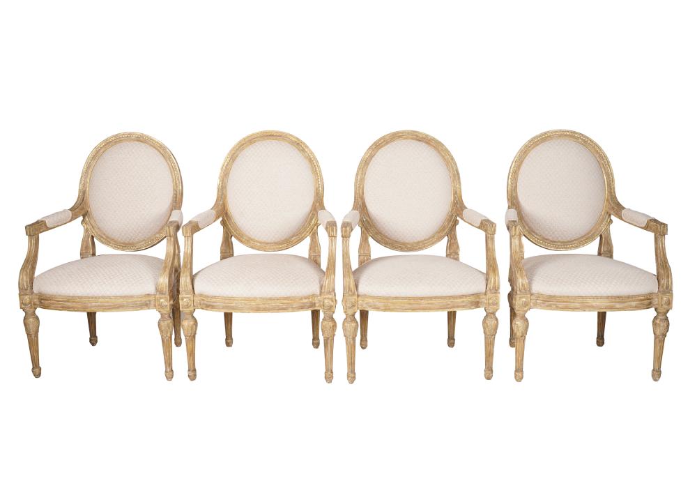 Appraisal: FOUR NEOCLASSIC CARVED GILTWOOD FAUTEUILScovered with textured fabric Condition frames