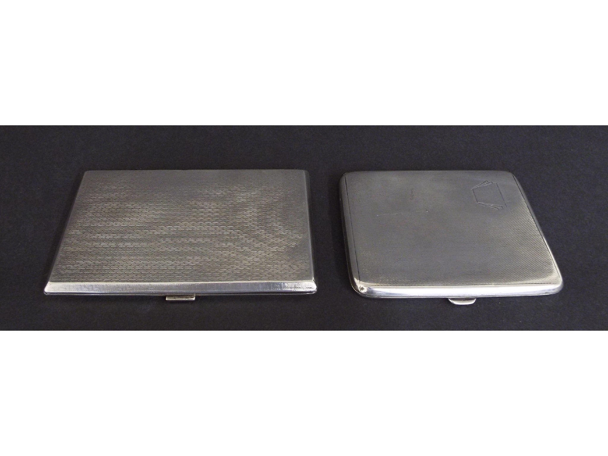 Appraisal: Two similar engine turned silver cigarette cases and long respectively