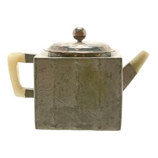 Appraisal: A Yixing Pewter-Encased Teapot The square form body is incised