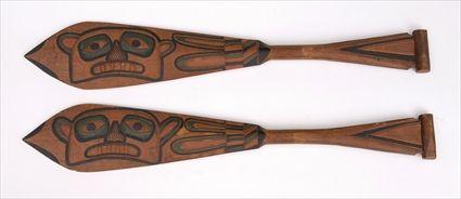 Appraisal: TWO PAINTED AND CARVED DANCE PADDLES With totemic figures x