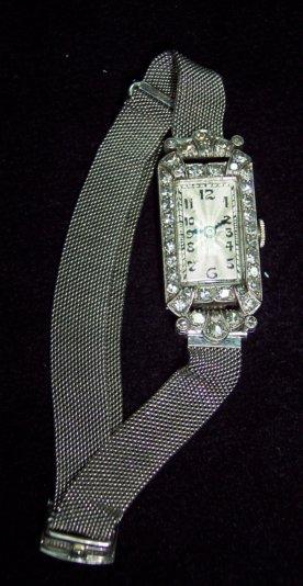 Appraisal: A lady's dress wristwatch platinum set diamonds the silvered dial