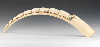 Appraisal: A Carved Ivory Tusk Hand carved with a procession of