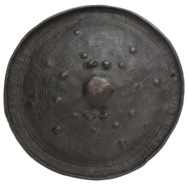 Appraisal: Patinated animal hide shield possible African interior with single semicircular