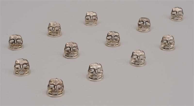 Appraisal: SET OF TWELVE ITALIAN SILVER MASK HEAD PLACE CARD HOLDERS