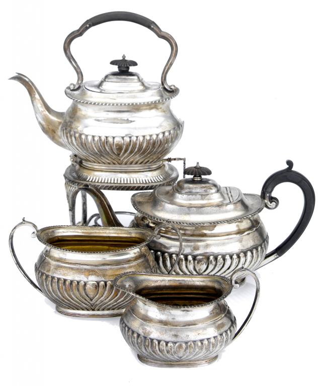 Appraisal: A GEORGE V FOUR-PIECE TEA SERVICE the lower body spirally