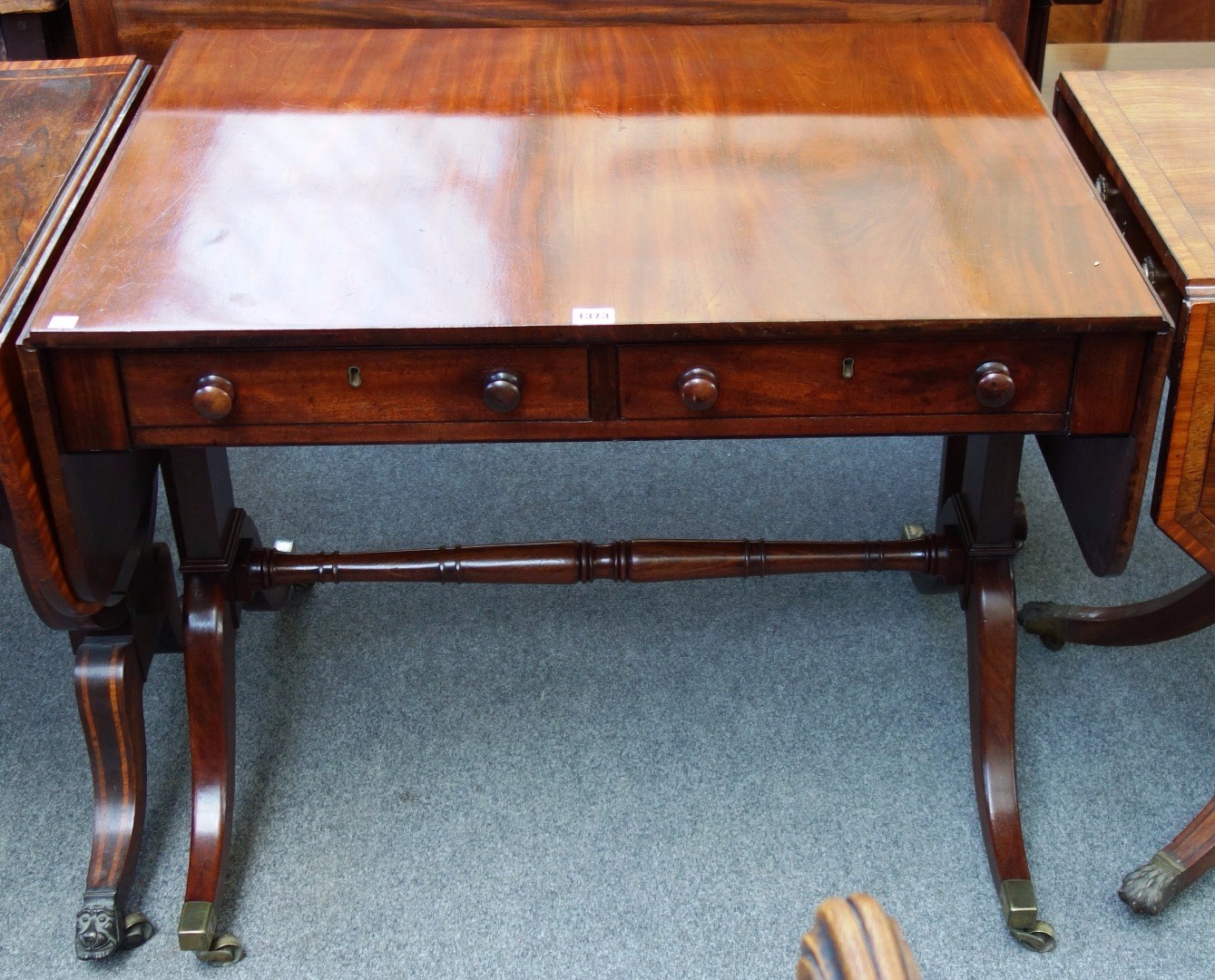 Appraisal: A George III mahogany sofa table with pair of frieze