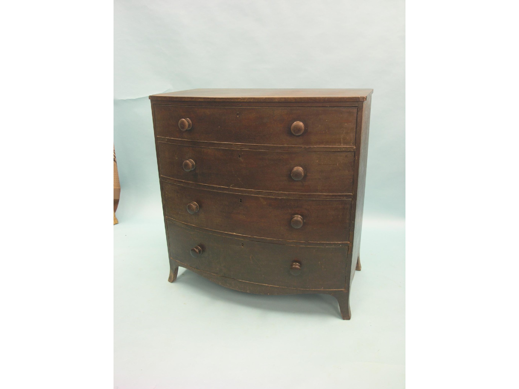 Appraisal: A Victorian bow-fronted mahogany chest four long drawers each oak-lined