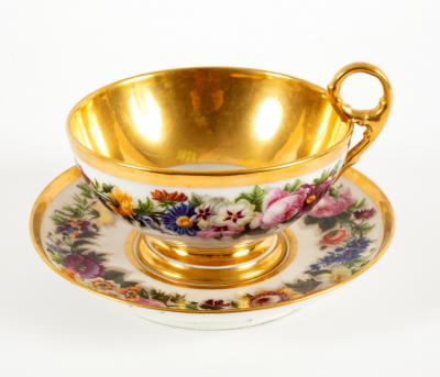 Appraisal: A French porcelain oversize teacup and saucer circa painted with