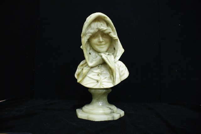 Appraisal: An alabaster bust of Lillian Gish modelled wearing a flower