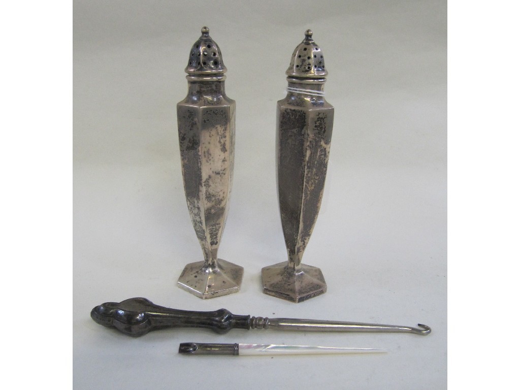 Appraisal: Lot comprising pair of sterling silver peppers a buttonhook and