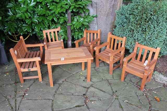 Appraisal: A SUITE OF TEAK CHILD'S GARDEN FURNITURE with slatted back