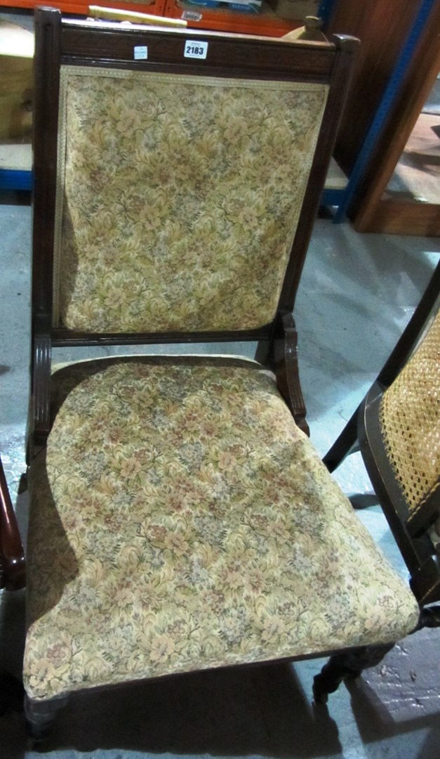 Appraisal: A th century mahogany framed nursing chair with floral upholstery