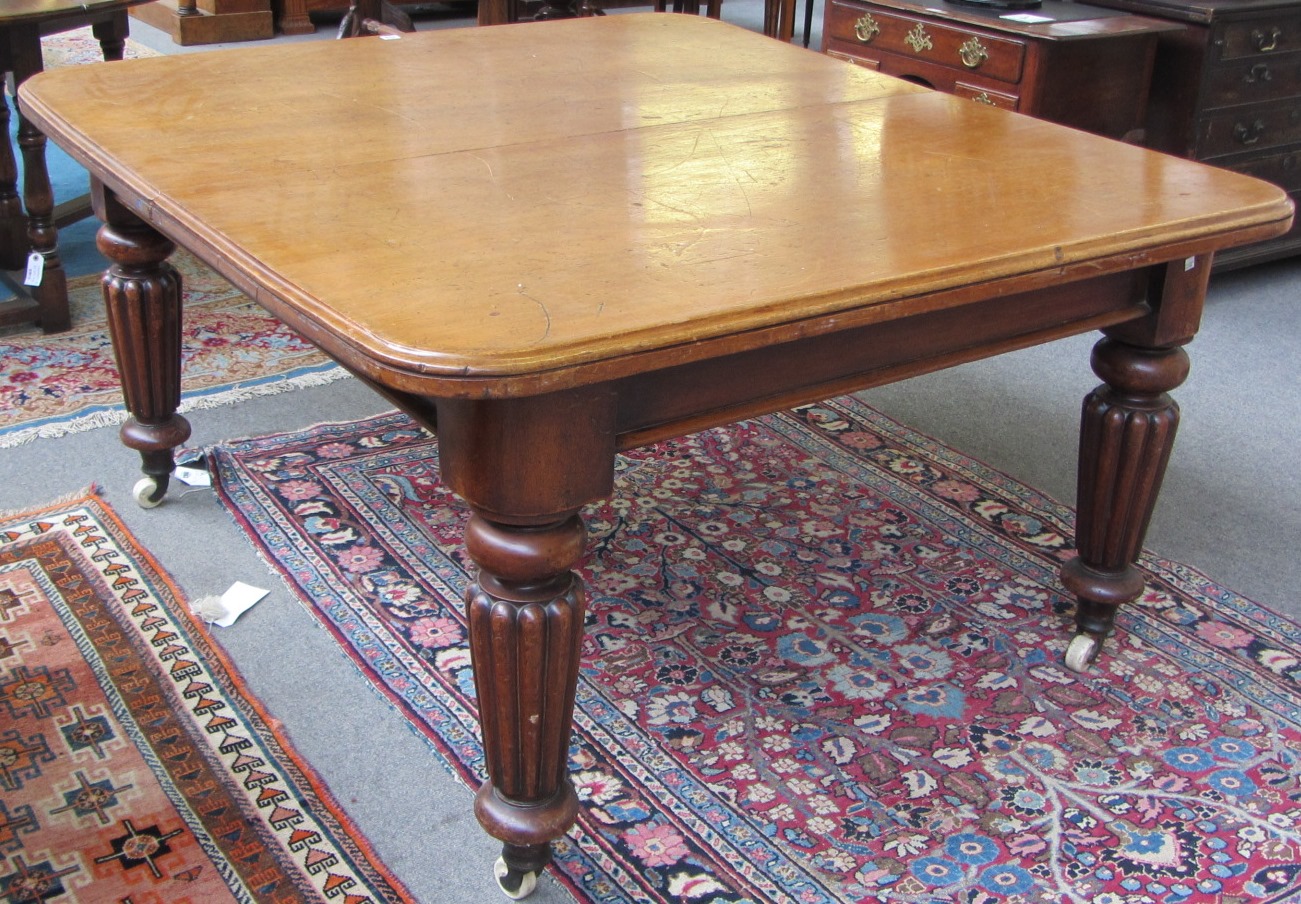 Appraisal: An early th century mahogany extending dining table on tapering