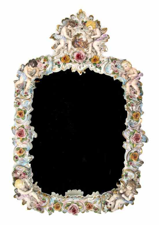 Appraisal: A Continental Porcelain Mirror having Rococo style decoration with applied