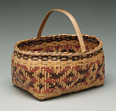 Appraisal: Cherokee river cane basket red and brown weavers in repeating