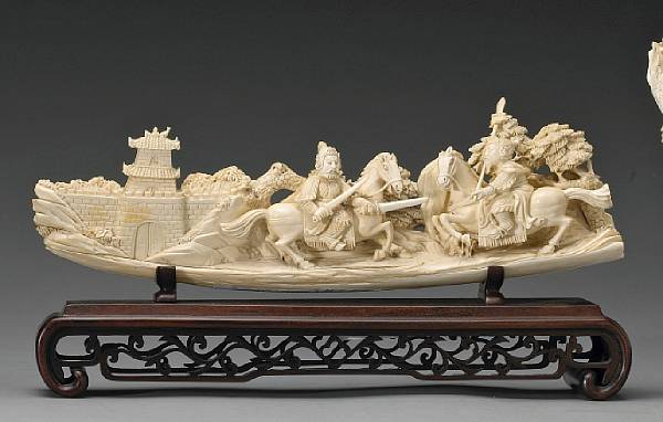 Appraisal: A carved ivory battle scene th Century The tusk section