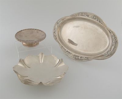 Appraisal: A modern lobed dressing table tray embossed with flowers around