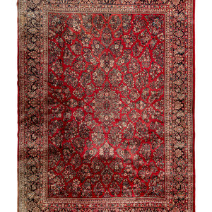 Appraisal: A Sarouk Wool Rug Circa feet inches x feet inches