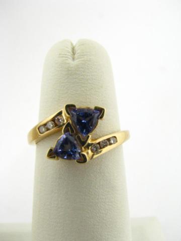 Appraisal: K yellow gold ring with two trillion cut tanzanite stones