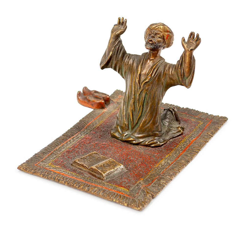 Appraisal: An Austrian Cold-Painted Bronze Figure of a Kneeling Man Praying