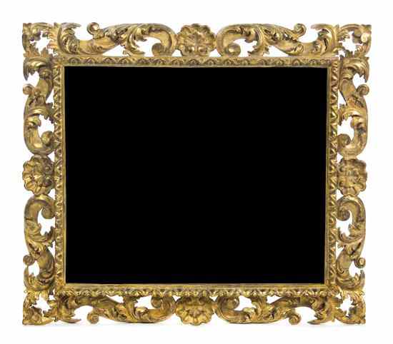 Appraisal: An Italian Giltwood Mirror having a pierce carved foliate and