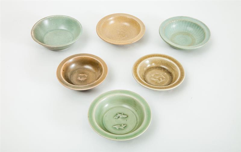 Appraisal: FOUR LONGQUAN TYPE CELADON-GLAZED TWIN FISH DISHES AND TWO OTHERS