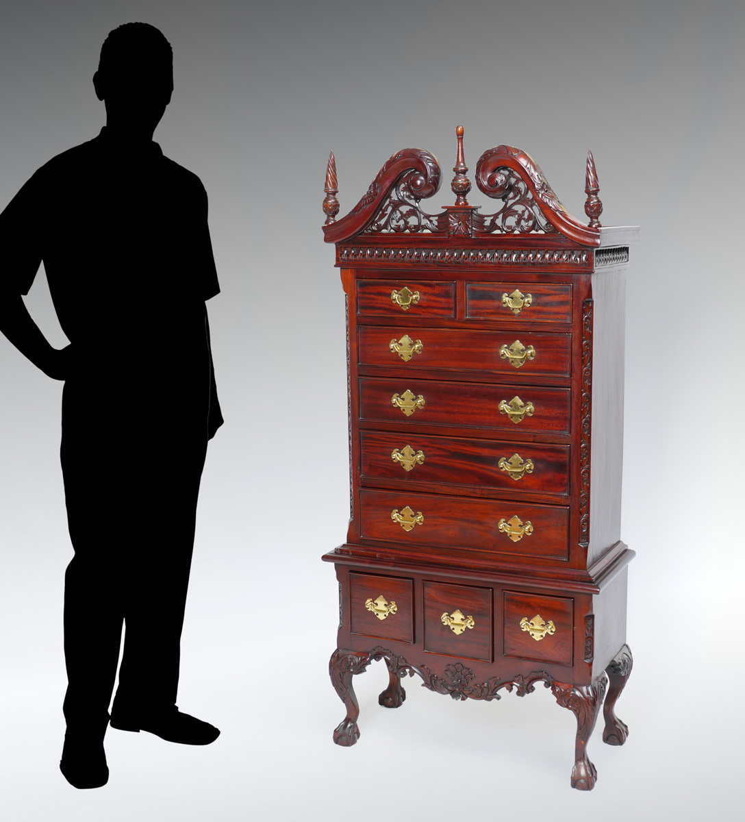 Appraisal: DIMINUTIVE CHIPPENDALE STYLE LINGERIE CHEST Surmounting carved pierced scrolling foliate