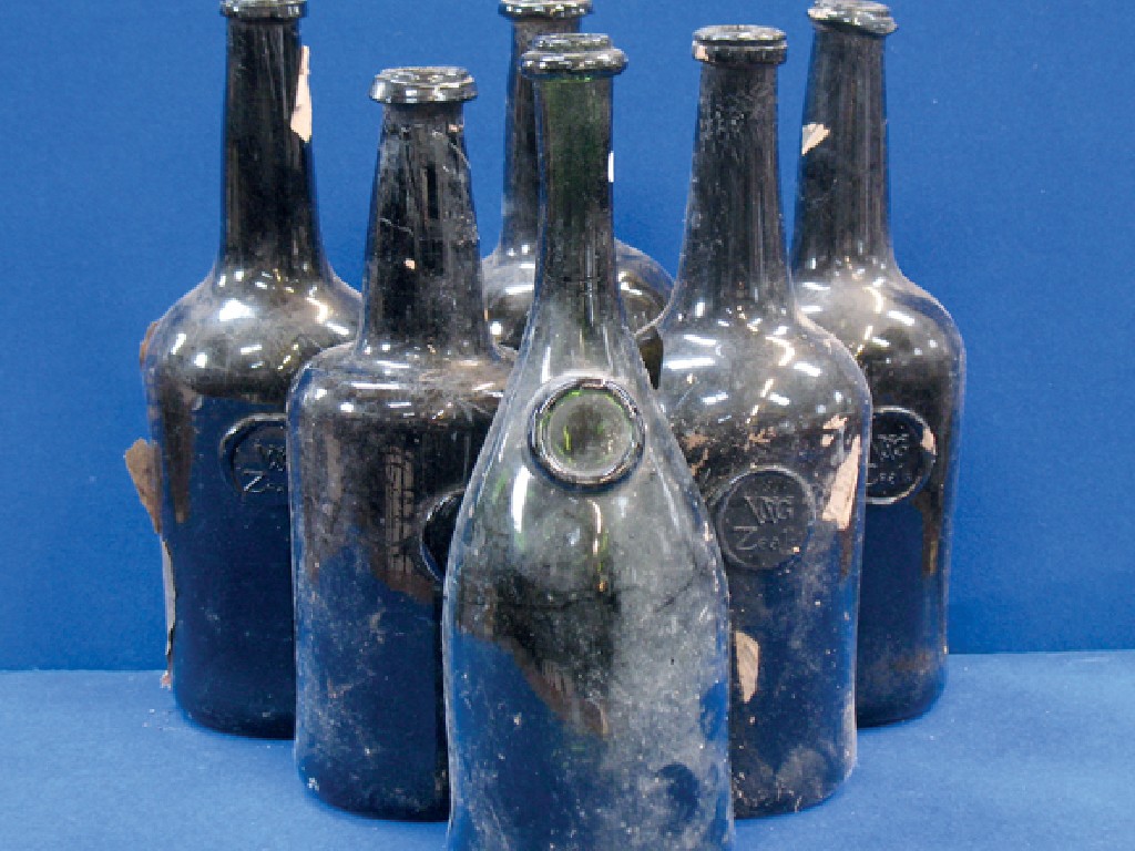 Appraisal: A COLLECTION OF SIX EARLY GREEN GLASS WINE BOTTLES with