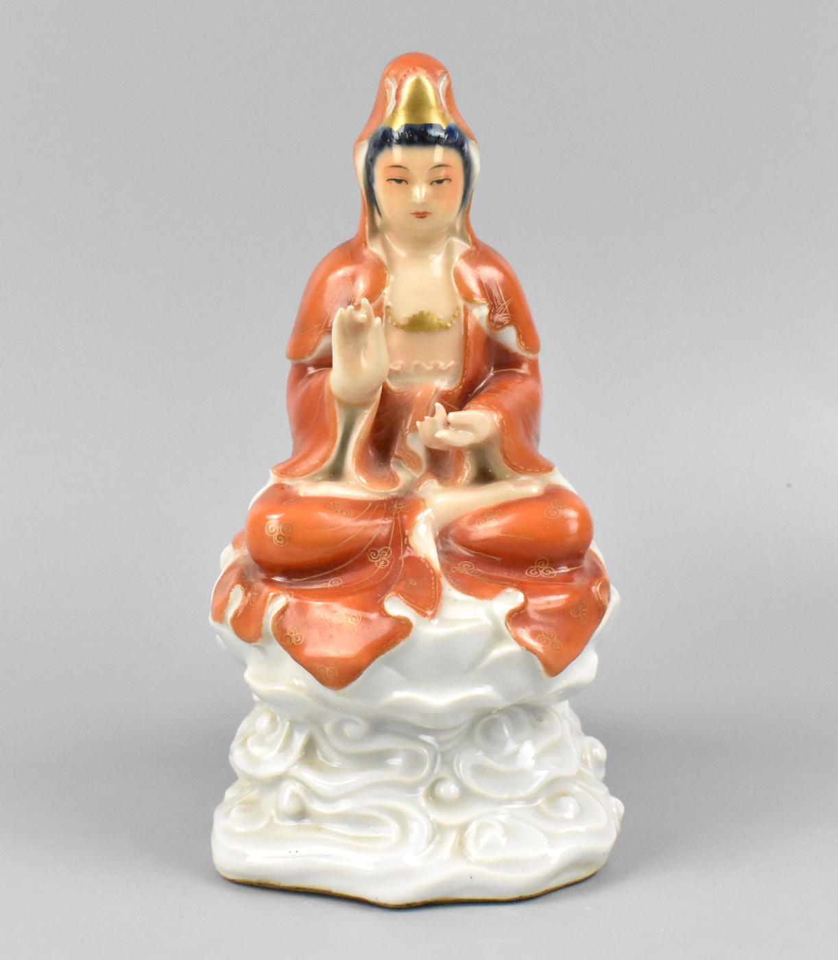 Appraisal: A Chinese gilt iron red porcelain guanyin figure The guanyin