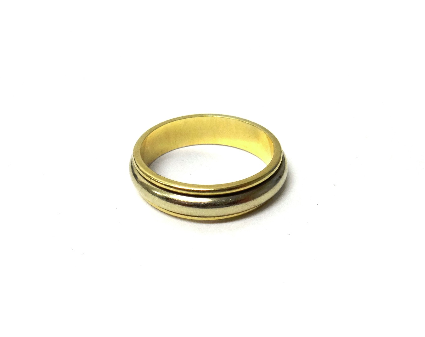 Appraisal: A two colour gold wedding ring having a central rotating