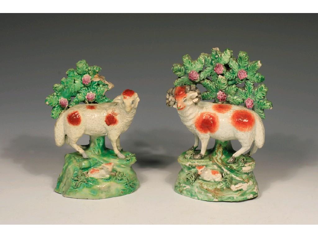 Appraisal: A PAIR OF STAFFORDSHIRE POTTERY WALTON TYPE RAM AND EWE