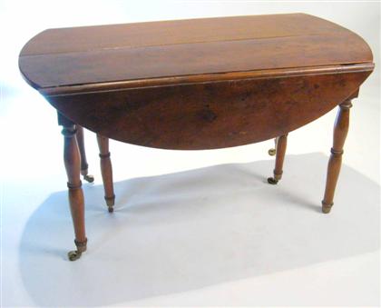 Appraisal: Directoire walnut extending drop leaf table th century The rectangular