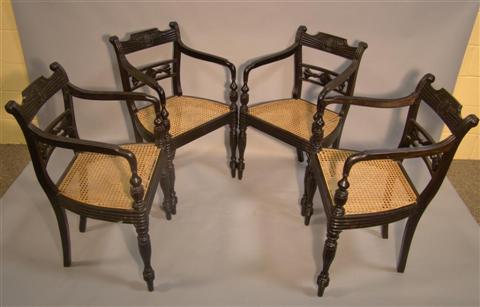 Appraisal: SET OF FOUR SRI LANKAN COLONIAL EBONY AND CANE DINING