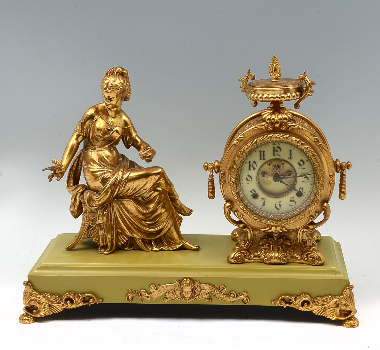 Appraisal: FIGURAL METAL NEW HAVEN CLOCK Seated woman with a bird