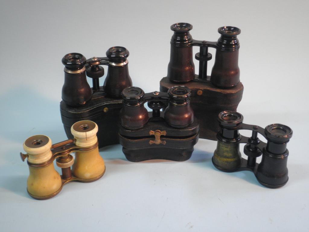 Appraisal: A pair of Ivory mounted opera glasses and four pairs