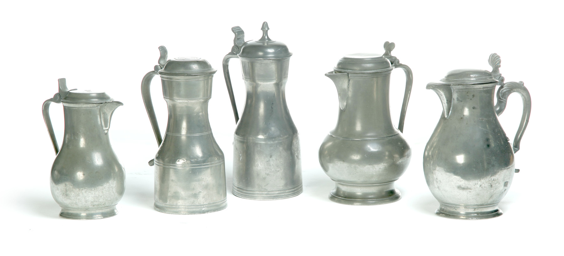 Appraisal: FIVE EUROPEAN PEWTER VESSELS Nineteenth century Two flaggons h and