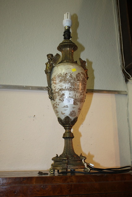 Appraisal: A REPRODUCTION CLASSICAL STYLE TABLE LAMP with winged supports cm