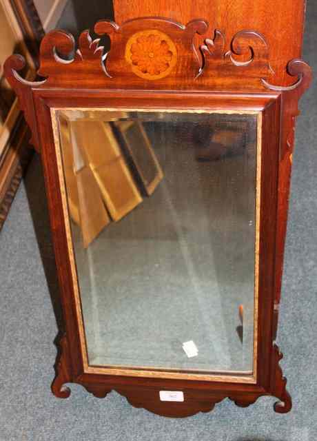 Appraisal: A CHIPPENDALE STYLE MAHOGANY WALL MIRROR with carved and pierced