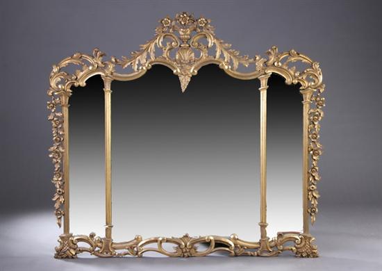 Appraisal: LATE VICTORIAN ROCOCO REVIVAL GILT WALL MIRROR th century Crested