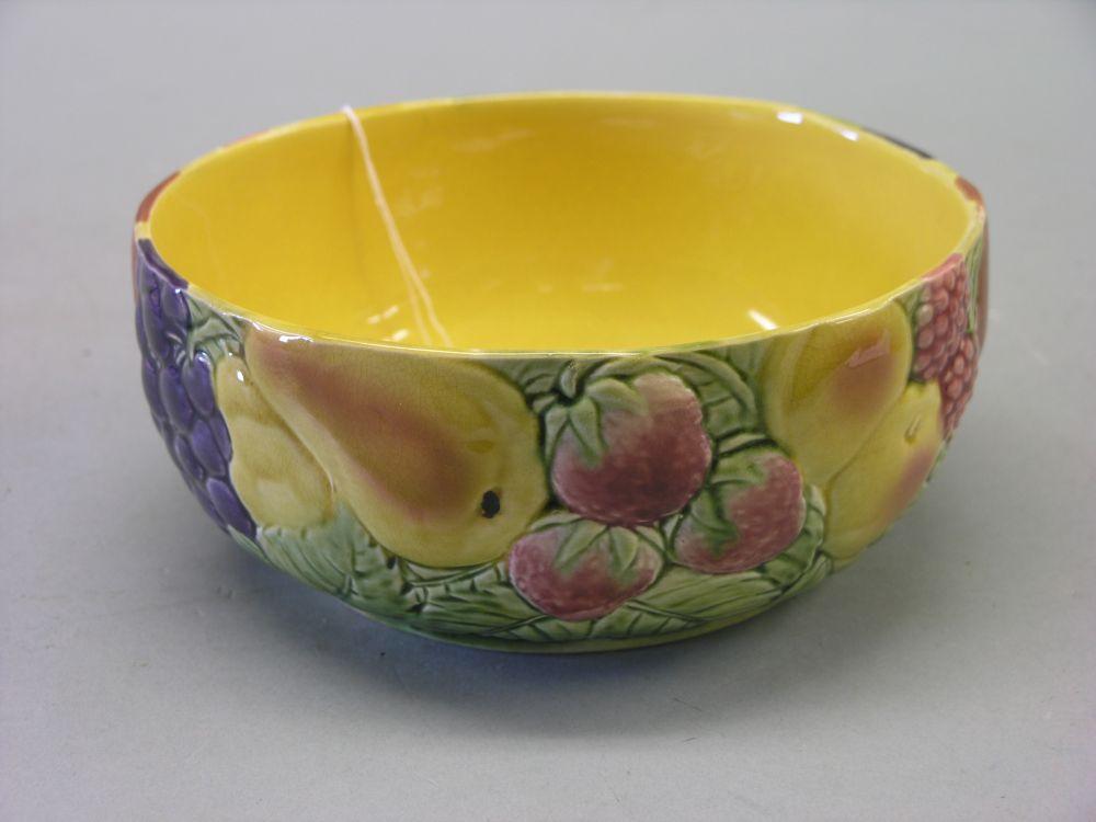 Appraisal: A Sarreguemines France fruit bowl relief moulded with a variety