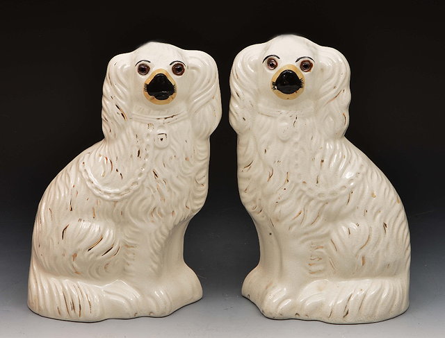 Appraisal: Pair of Staffordshire Pottery model spaniels cm high