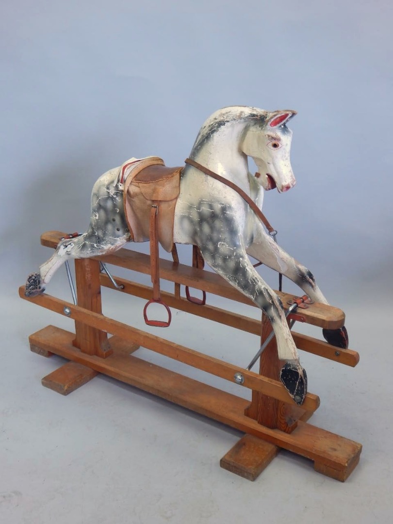 Appraisal: A mid thC Jeeves grey dapple painted rocking horse on