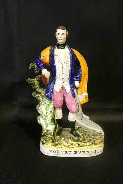 Appraisal: A th century polychrome Staffordshire figure of Robert Burns cm