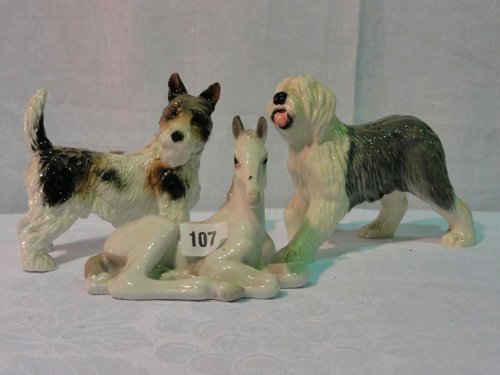 Appraisal: A USSR model of a recumbent white foal a continental