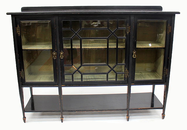 Appraisal: A LATE VICTORIAN BLACK PAINTED GLAZED CABINET with a central