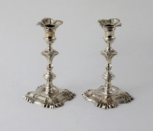 Appraisal: A pair of George II cast silver candlesticks George Boothby