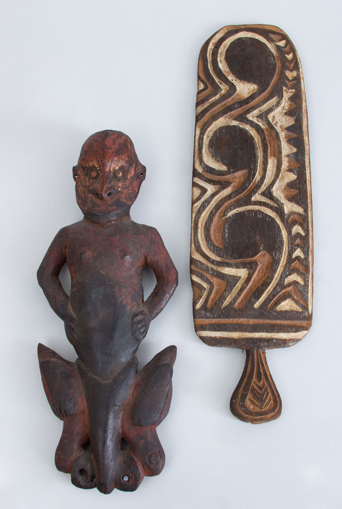 Appraisal: TWO PAPUA NEW GUINEA CARVED WOOD ARTICLES Including a painted